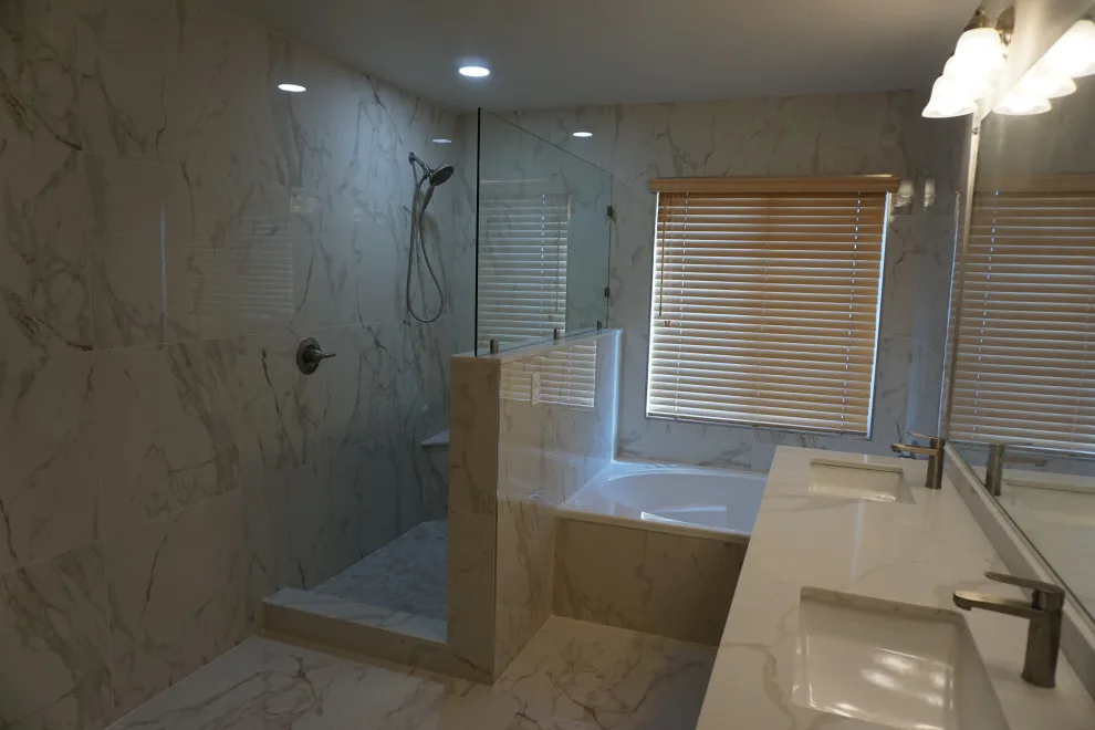 Silver and white marble bathroom renovation by Amos Tile LV - Photo 3