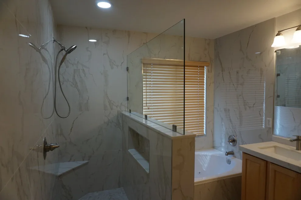 Silver and white marble bathroom renovation by Amos Tile LV - Photo 4