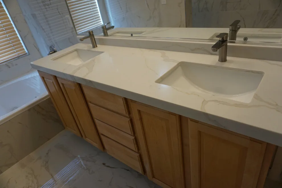 Silver and white marble bathroom renovation by Amos Tile LV - Photo 6