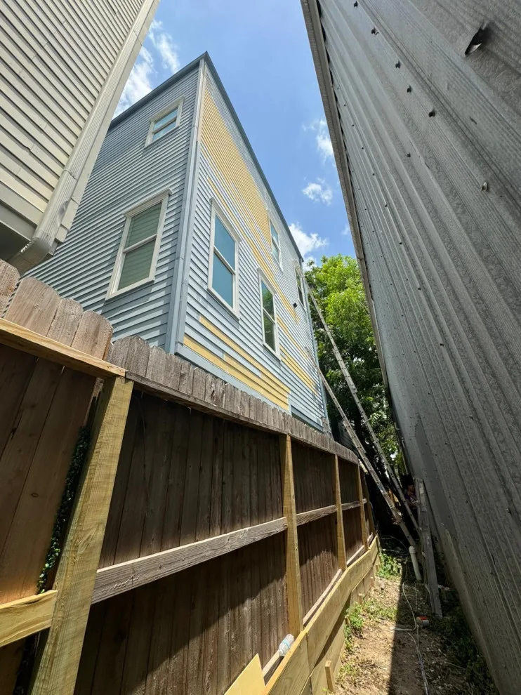 Siding restoration and new paint application by Universal Roofing And Restoration - Photo 2