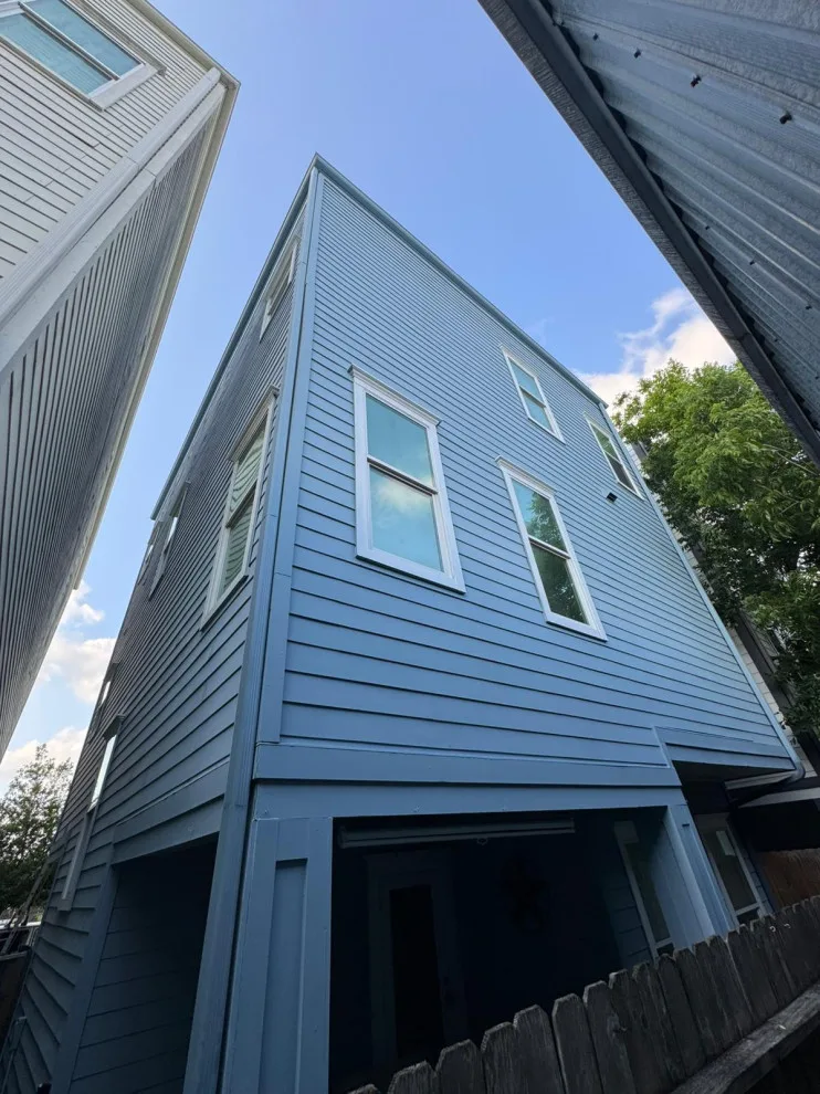 Siding restoration and new paint application by Universal Roofing And Restoration - Photo 3