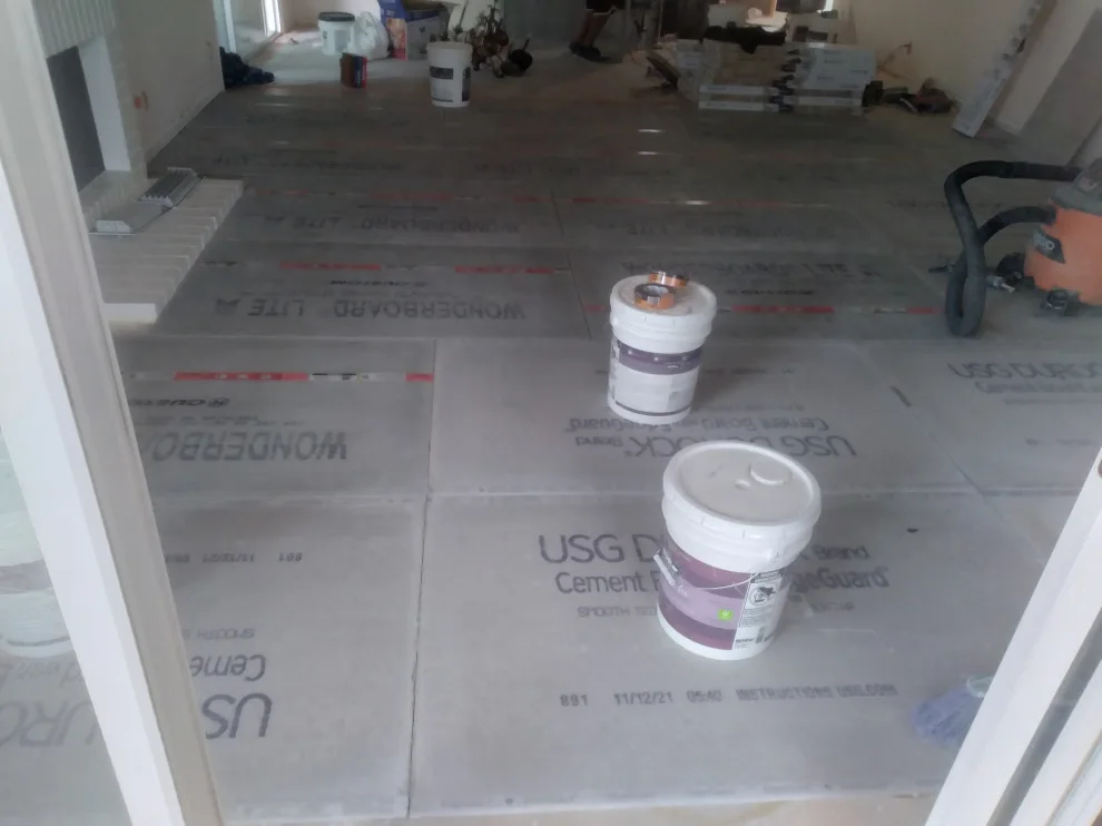 Flooring, popcorn ceiling removal, and interior painting by Rigos Painting Services - Photo 5
