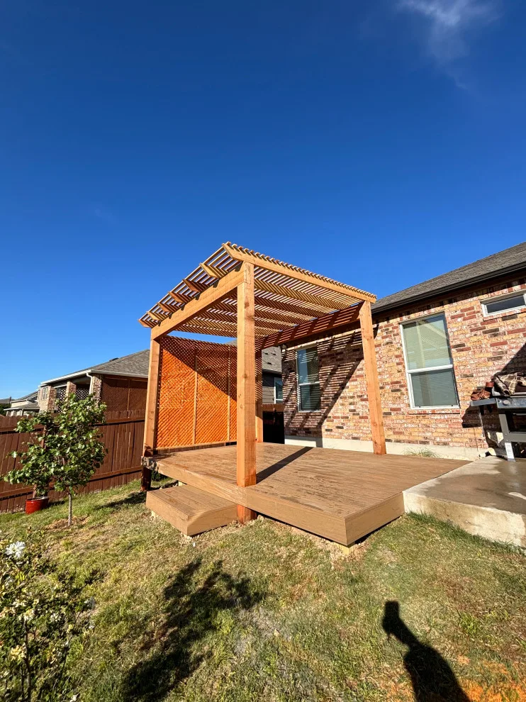 Stunning composite deck featuring a rustic cedar pergola by ATX Outdoor Construction LLC - Photo 3