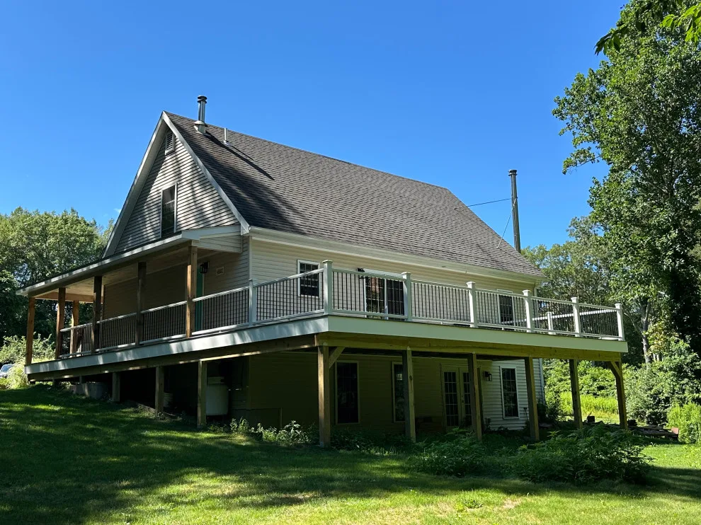 Enclosed wraparound porch by Bolton Home Remodelers - Photo 8