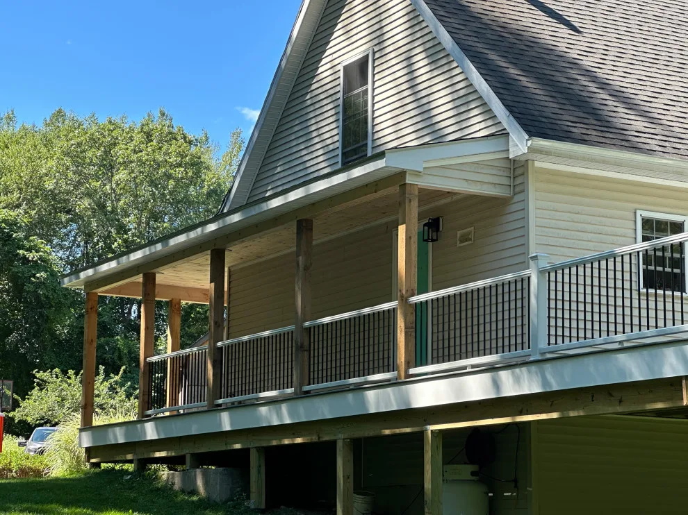 Enclosed wraparound porch by Bolton Home Remodelers - Photo 10