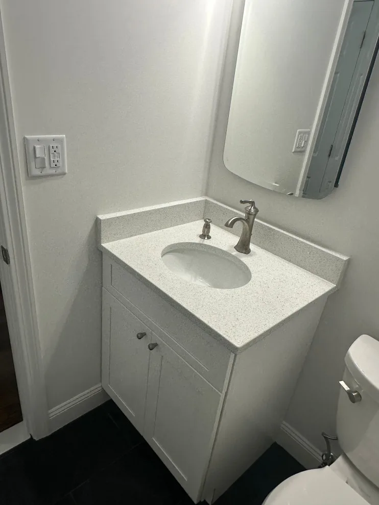 Compact master bathroom makeover featuring a bespoke tile shower and custom glass enclosure by Bolton Home Remodelers - Photo 7
