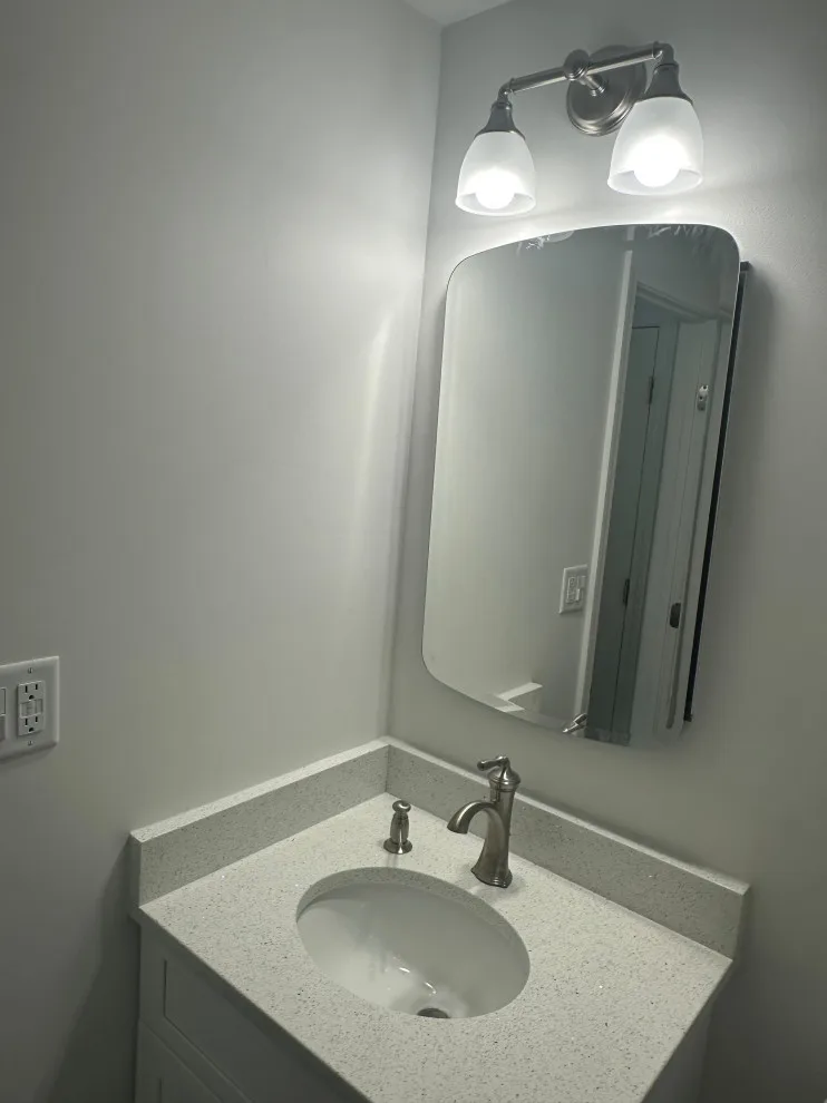 Compact master bathroom makeover featuring a bespoke tile shower and custom glass enclosure by Bolton Home Remodelers - Photo 4