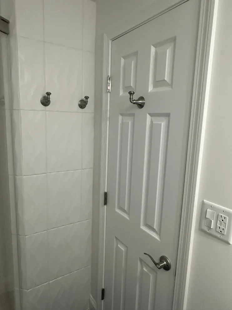 Compact master bathroom makeover featuring a bespoke tile shower and custom glass enclosure by Bolton Home Remodelers - Photo 5