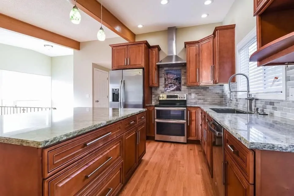 Kitchen renovation transformation by Craftsman Construction - Photo 2