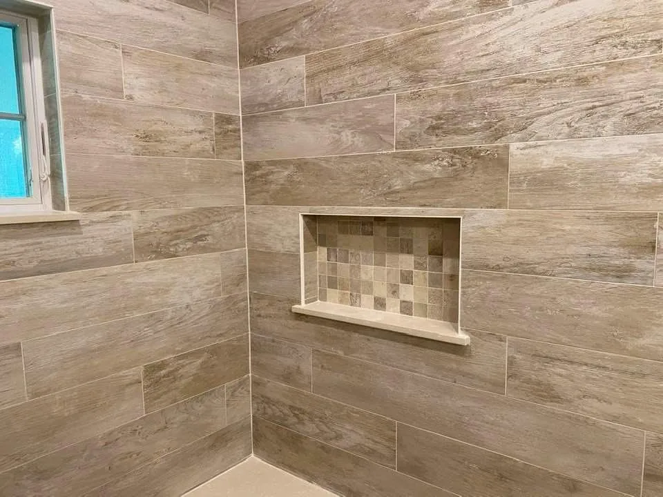 Shower with a step-in design by Hourglass Home Improvements Inc. - Photo 2
