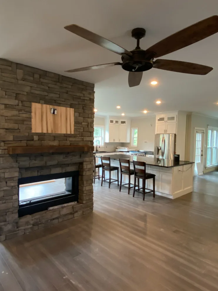 Kitchen Expansion with Dual-Sided Fireplace, Lighting, and Flooring by Riverstone Construction And Home Improvement - Photo 15