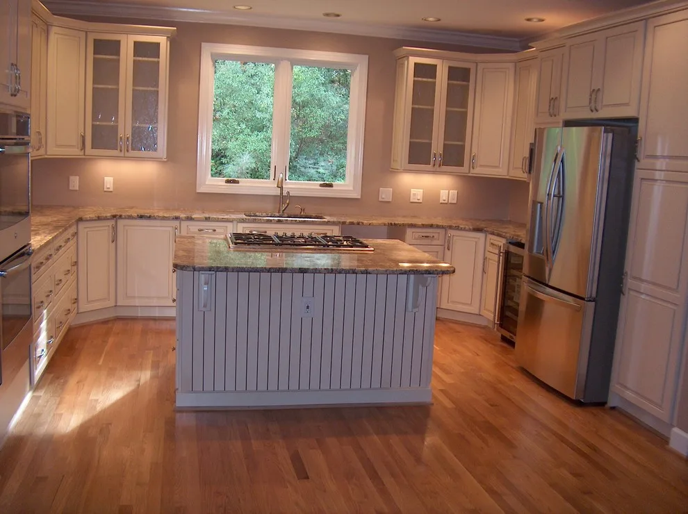 Kraftmaid kitchen with Netuno Bordeaux countertops by A.M.Carter Construction Inc - Photo 2