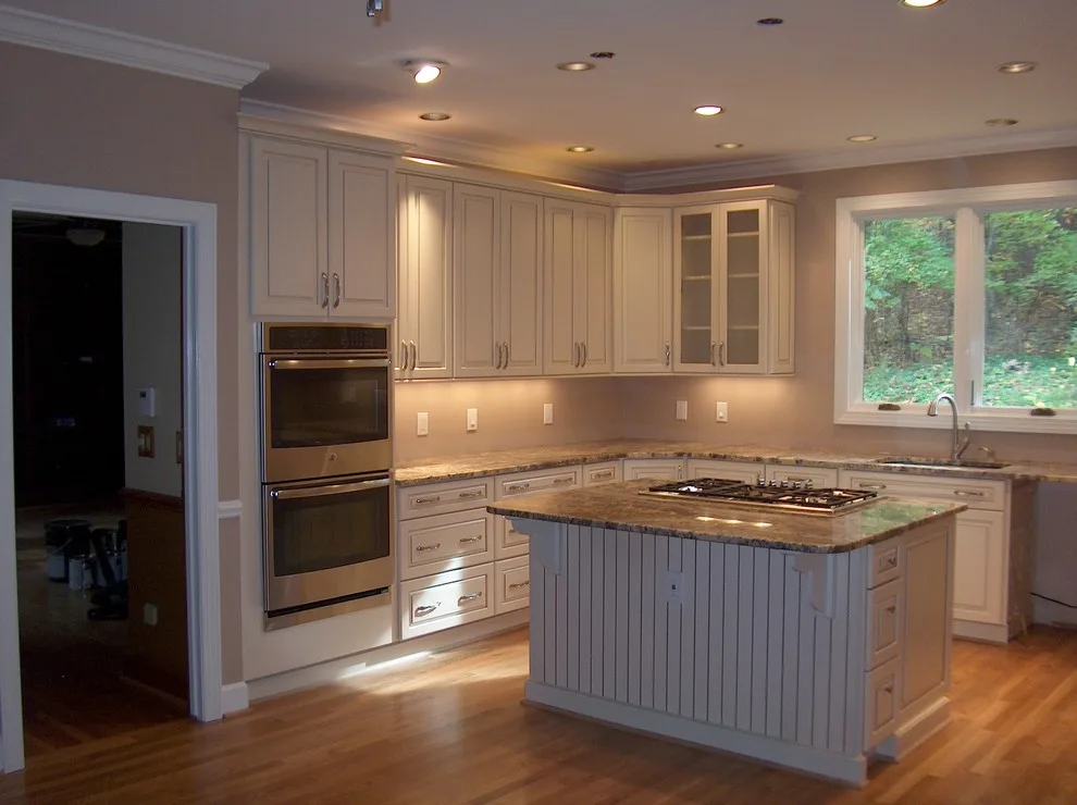 Kraftmaid kitchen with Netuno Bordeaux countertops by A.M.Carter Construction Inc - Photo 3