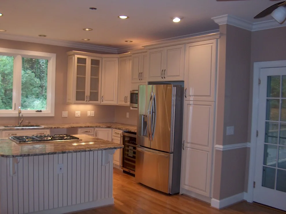 Kraftmaid kitchen with Netuno Bordeaux countertops by A.M.Carter Construction Inc - Photo 4