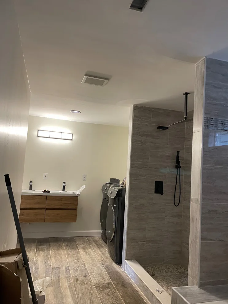 Primary Bathroom with Laundry by JV Custom Construction LLC - Photo 4