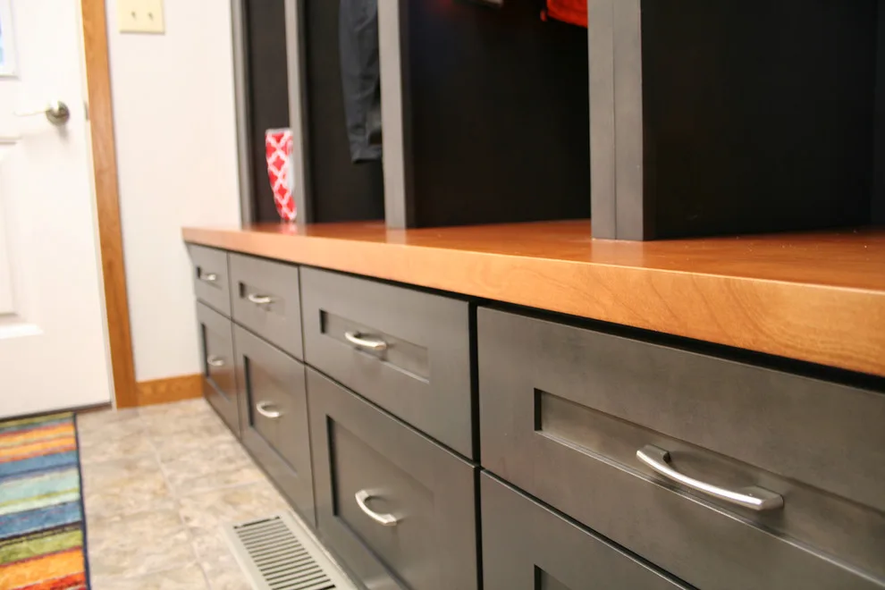 Storage and Laundry Area by Kitchens Inc. - Photo 12