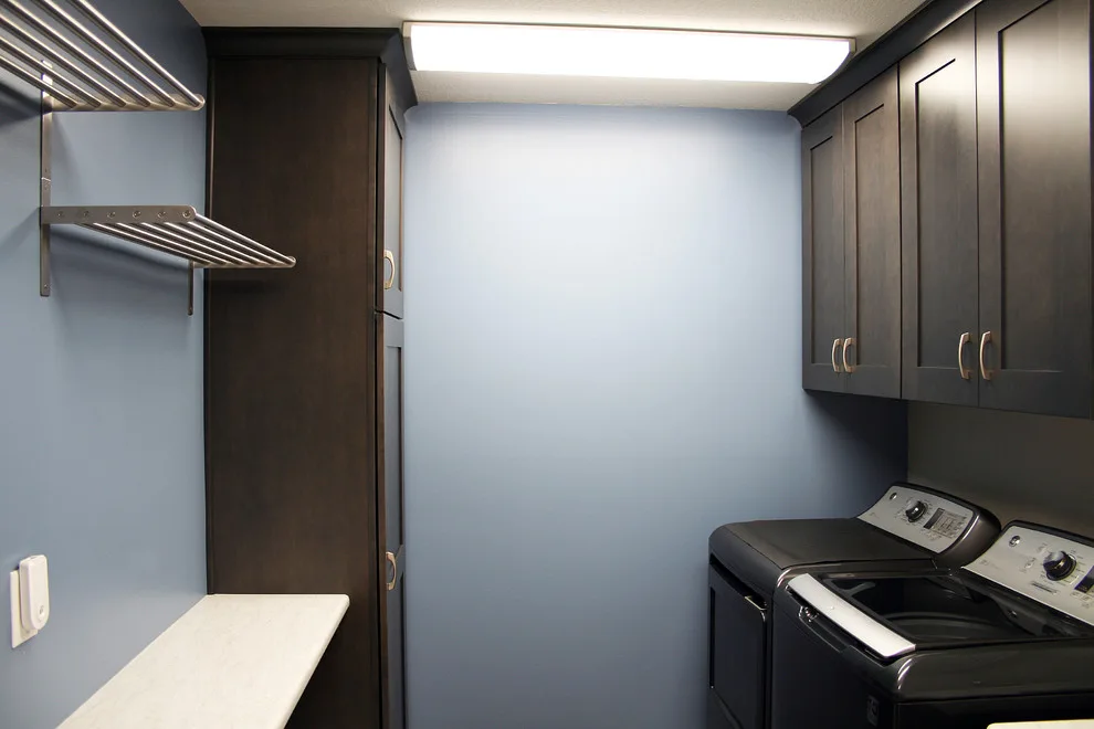 Storage and Laundry Area by Kitchens Inc. - Photo 10