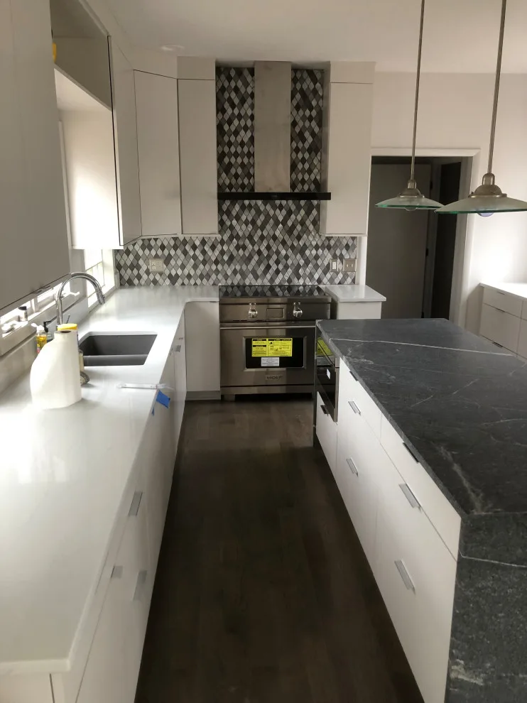 primary bath, half bath, kitchen by Spencer Remodeling - Photo 17