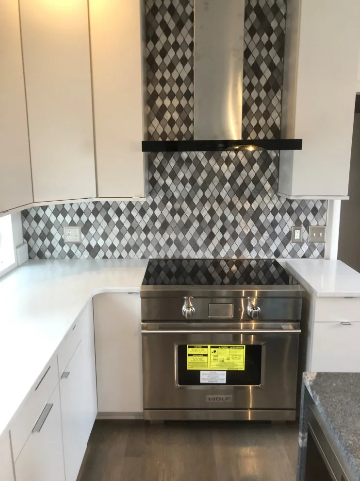 primary bath, half bath, kitchen by Spencer Remodeling - Photo 13