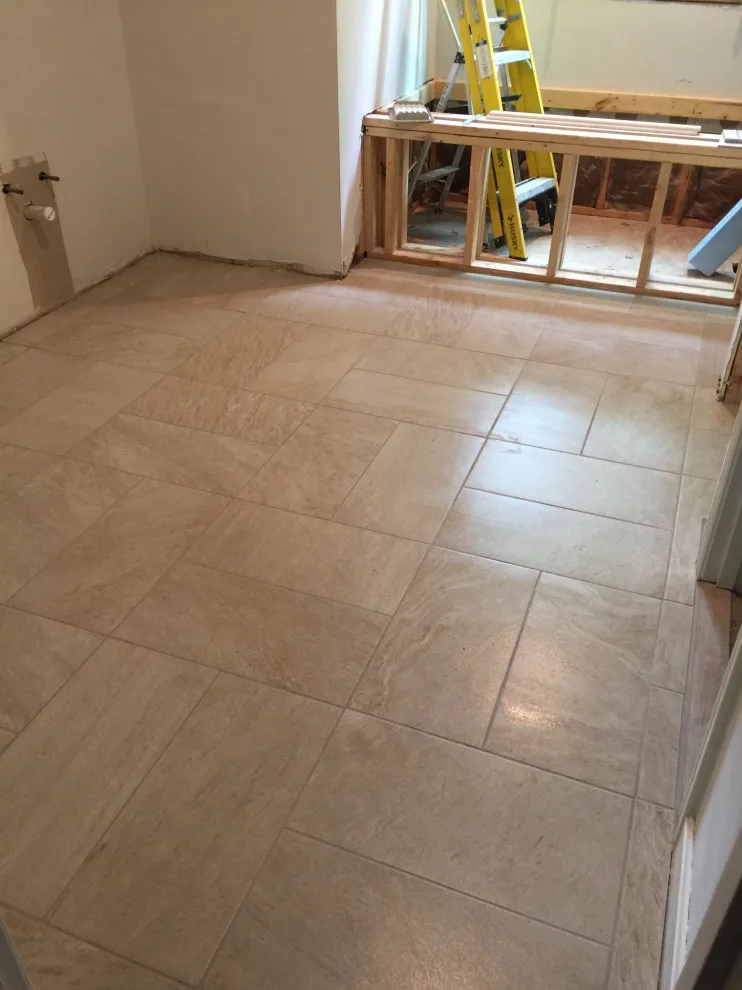 primary bathroom flooring by Spencer Remodeling - Photo 4