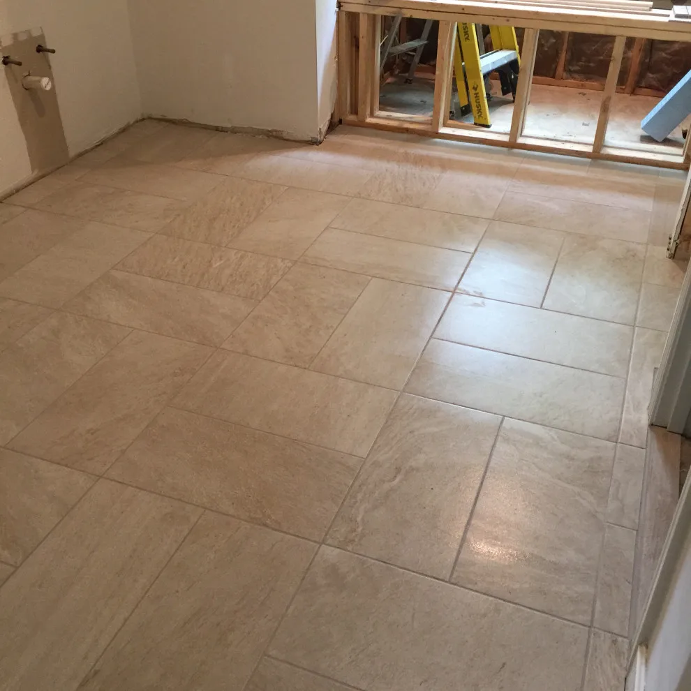 primary bathroom flooring by Spencer Remodeling - Photo 5