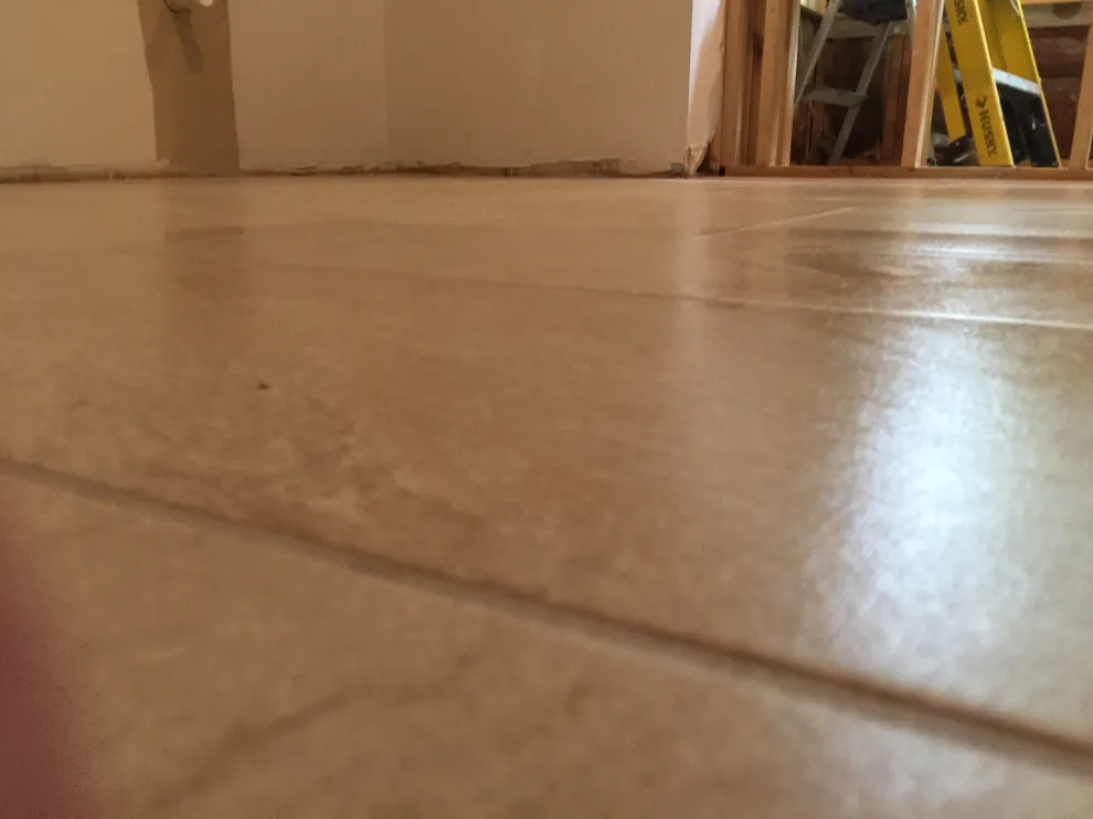 primary bathroom flooring by Spencer Remodeling - Photo 3