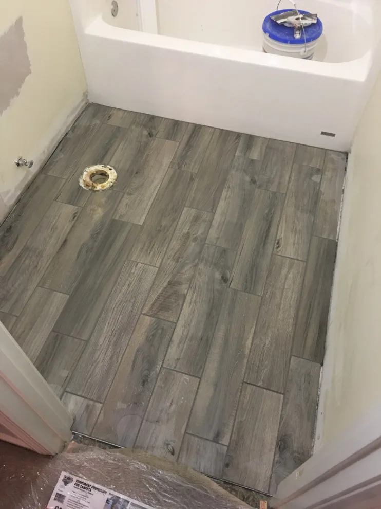 Primary bathroom and new hallway bath flooring by Spencer Remodeling - Photo 6