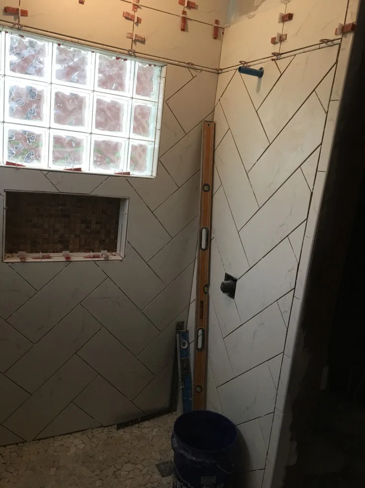 Primary bathroom and new hallway bath flooring by Spencer Remodeling - Photo 7