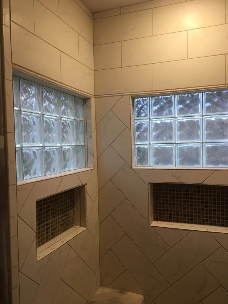 Primary bathroom and new hallway bath flooring by Spencer Remodeling - Photo 2