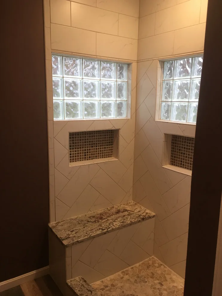 Primary bathroom and new hallway bath flooring by Spencer Remodeling - Photo 4