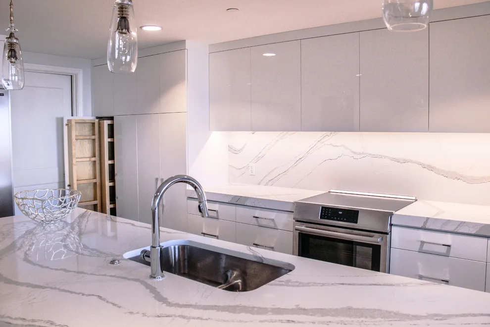 Contemporary Kitchen Revamp in White Acrylic by Kitchen Solvers Of The Gulf Coast - Photo 6