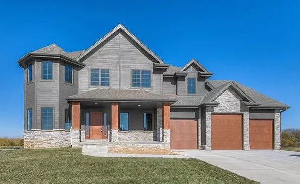 Custom Home with Wooden Pillars by Empire Homes And Remodeling Inc. - Photo 2