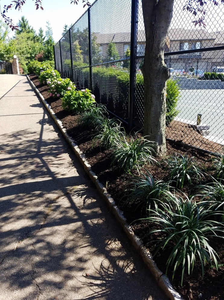 Tennis court landscape design by Z.O. Landscaping - Photo 4