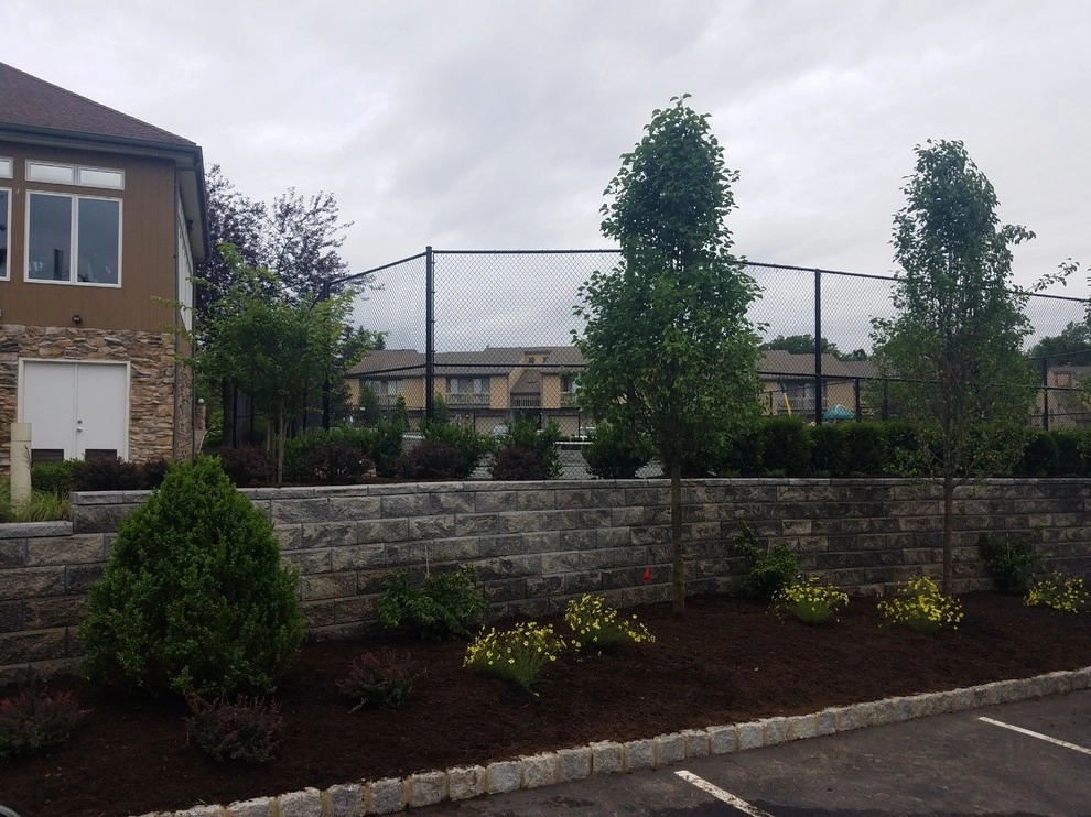 Tennis court landscape design by Z.O. Landscaping - Photo 9