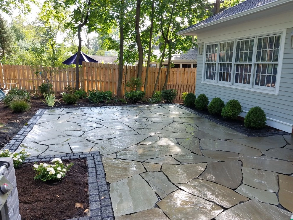 Irregular Blue Stone Patio with cobble border by Z.O. Landscaping - Photo 8