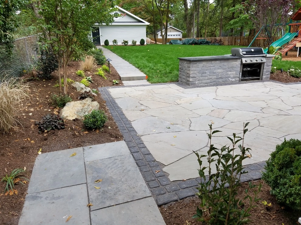 Irregular Blue Stone Patio with cobble border by Z.O. Landscaping - Photo 7