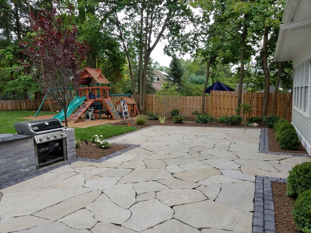 Irregular Blue Stone Patio with cobble border by Z.O. Landscaping - Photo 2