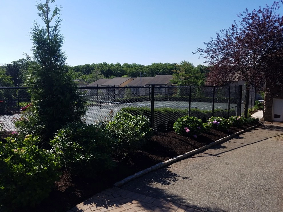 Tennis court landscape design by Z.O. Landscaping - Photo 7