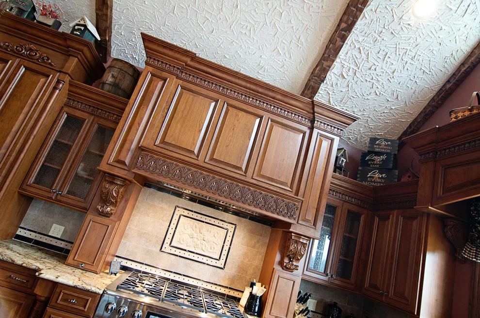 Elegant bespoke kitchen by Cornerstone Builders Of Terre Haute, Inc. - Photo 37