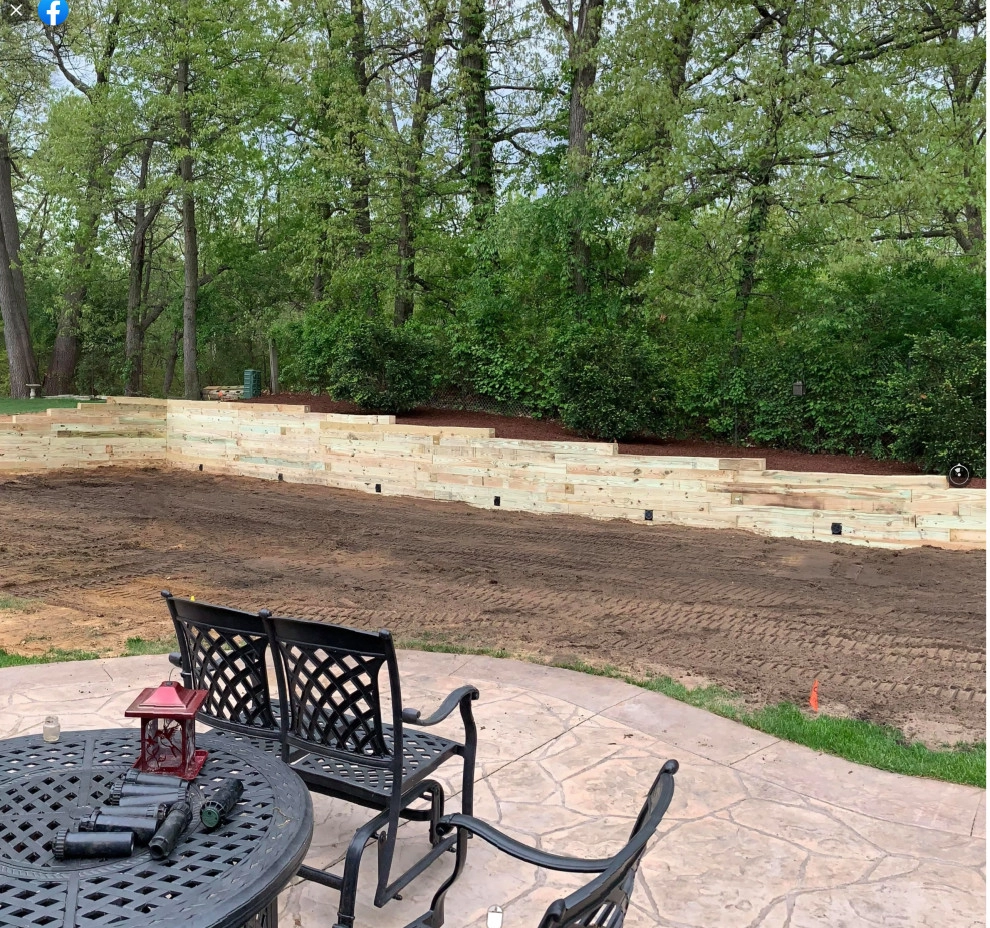 Reclaiming Back Yard with Large Retaining Wall by A+ Equipment Services And Excavation - Photo 4