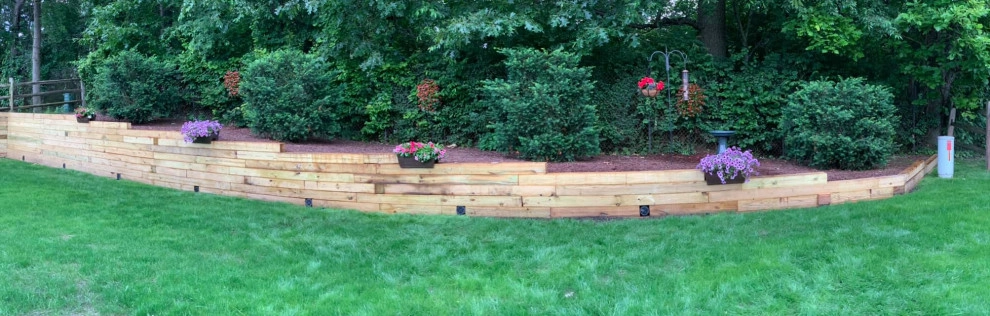 Reclaiming Back Yard with Large Retaining Wall by A+ Equipment Services And Excavation - Photo 3