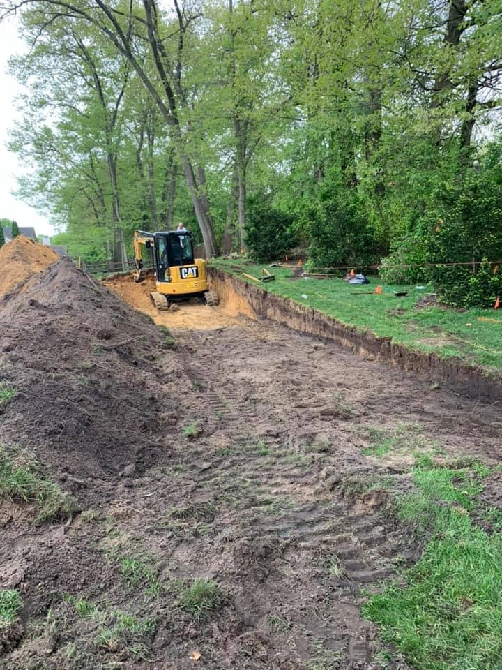 Reclaiming Back Yard with Large Retaining Wall by A+ Equipment Services And Excavation - Photo 6