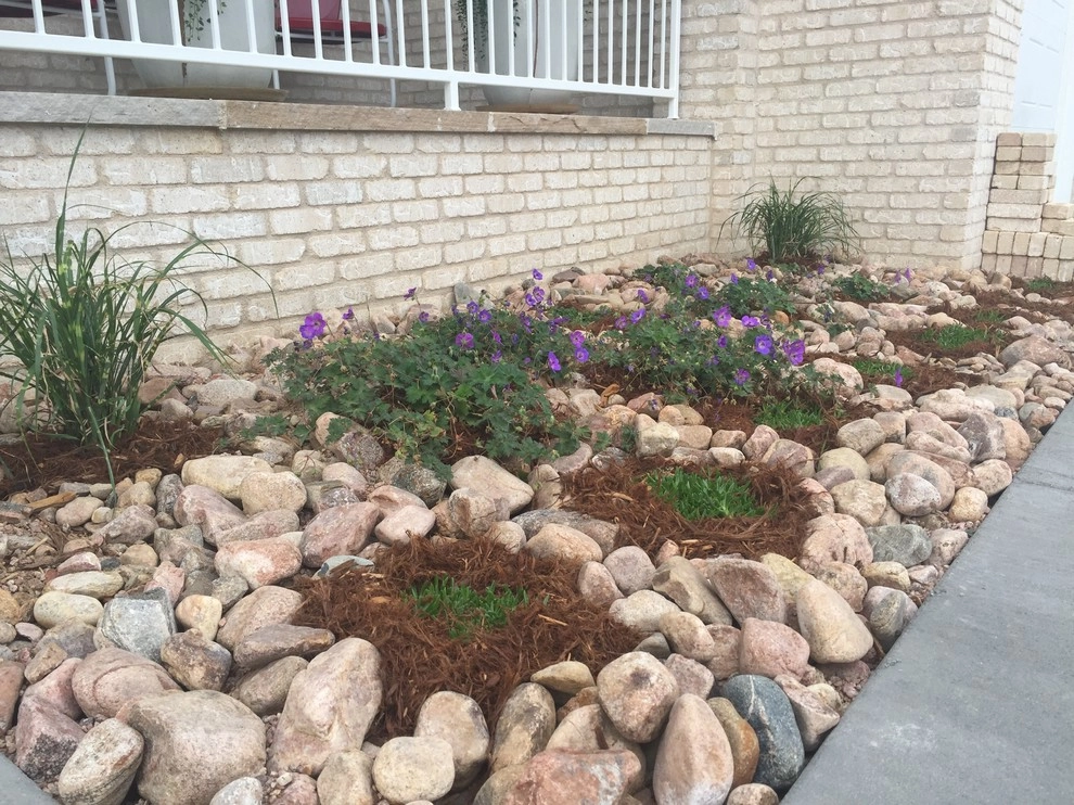 Windsor Lake landscape, paver path, and pond installation by All Terrain Landscaping - Photo 2