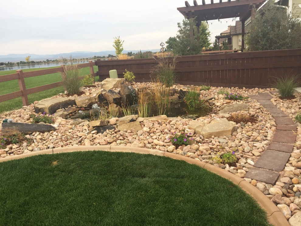 Windsor Lake landscape, paver path, and pond installation by All Terrain Landscaping - Photo 4