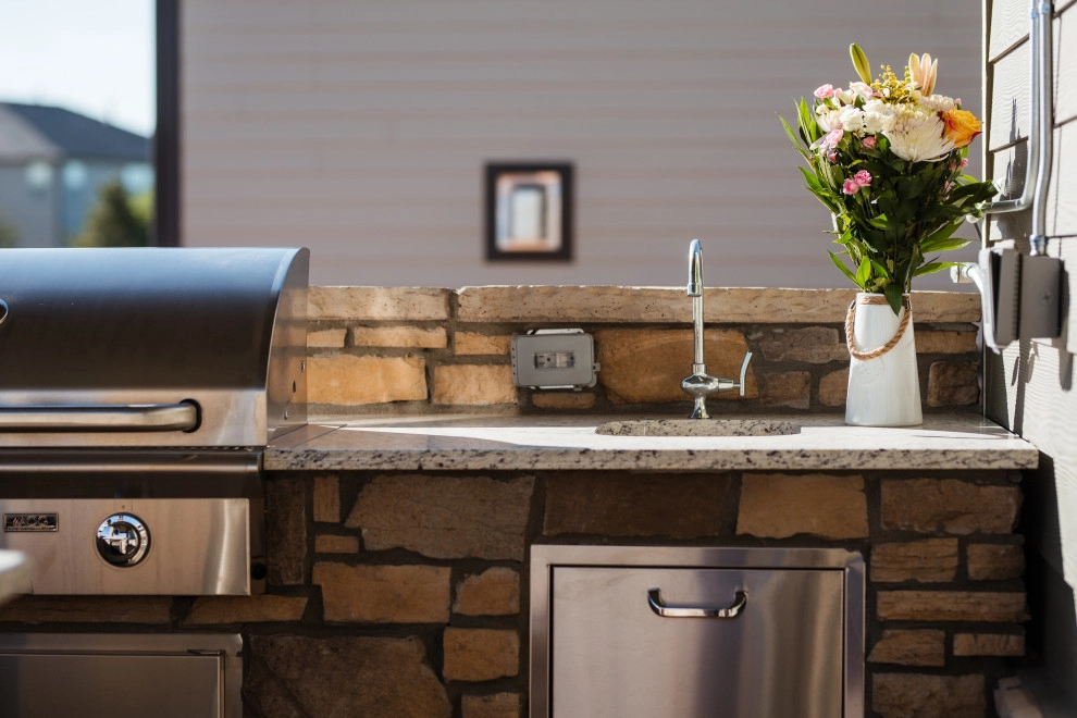 Stone Fireplace Wall and Outdoor Kitchen by All Terrain Landscaping - Photo 2