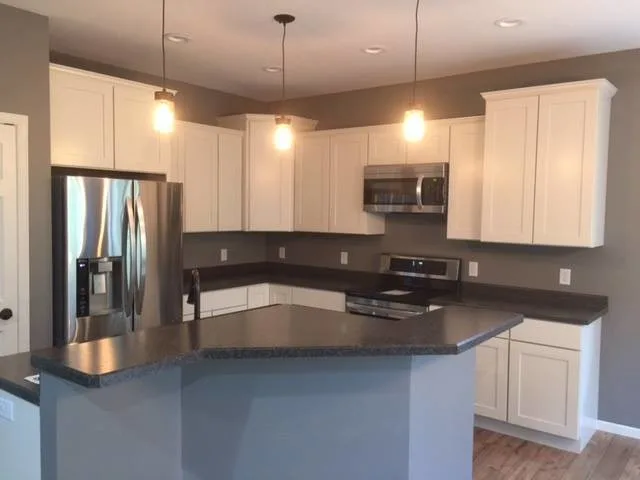 Kitchen Island Inspirations by Wausau Homes Manistique - Photo 16