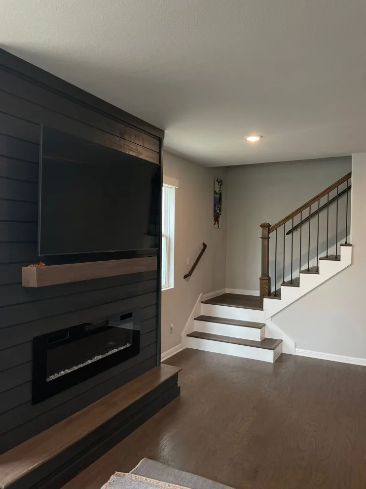 Fireplace and Staircase with New Flooring by Austin Dream Remodeling - Photo 7
