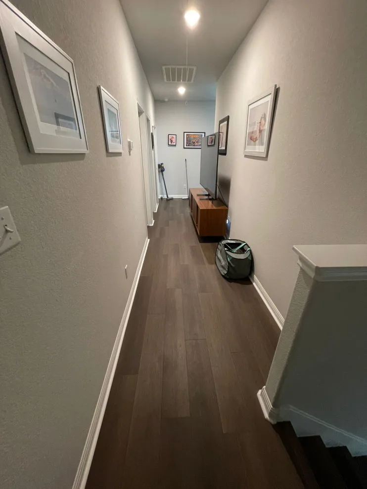 Fireplace and Staircase with New Flooring by Austin Dream Remodeling - Photo 11