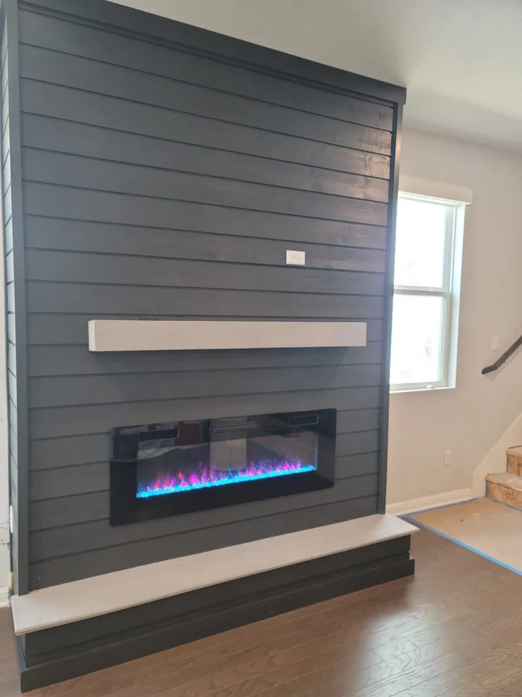 Fireplace and Staircase with New Flooring by Austin Dream Remodeling - Photo 10