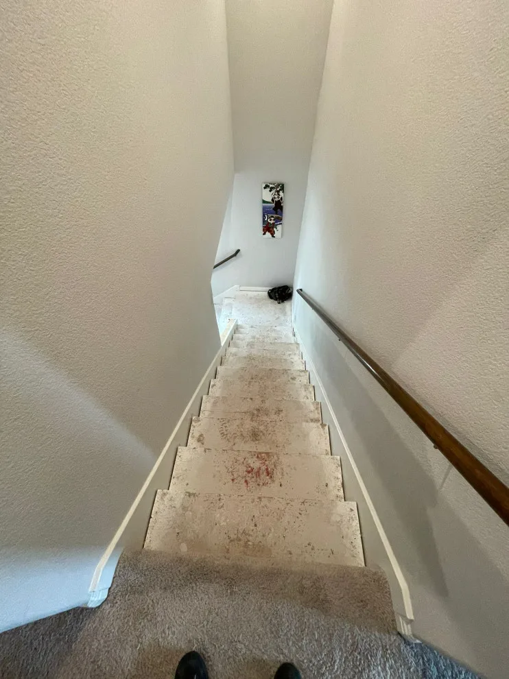 Fireplace and Staircase with New Flooring by Austin Dream Remodeling - Photo 2
